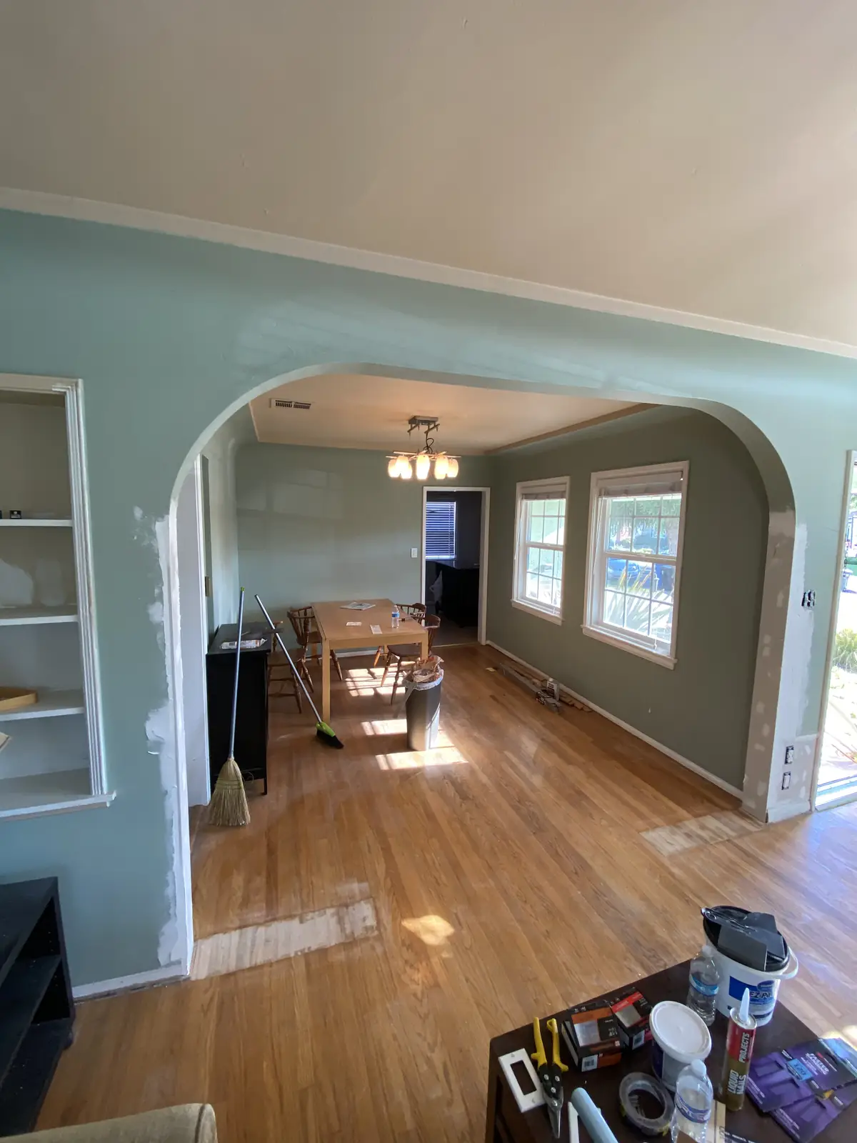 Plaster repair and prep around a living-room archway before painting