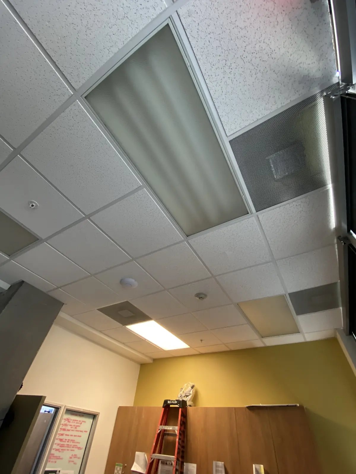 Drop-ceiling tiles and panels replaced in a commercial space