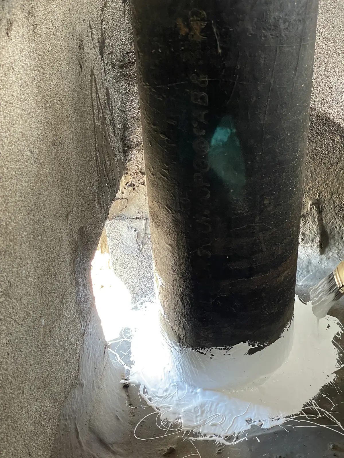 Sealing around a pipe penetration to stop a water leak